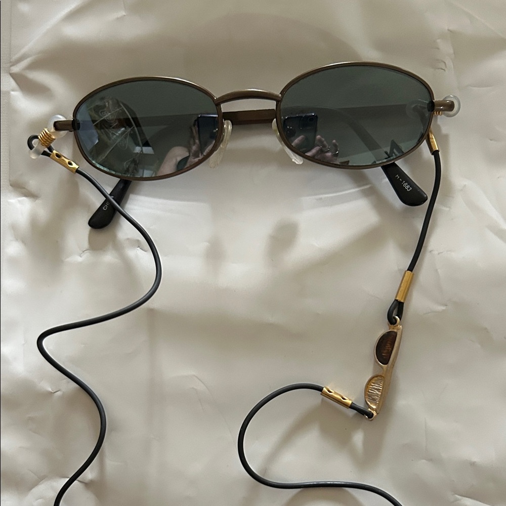 Oval Sunglasses with Black and Gold Accents